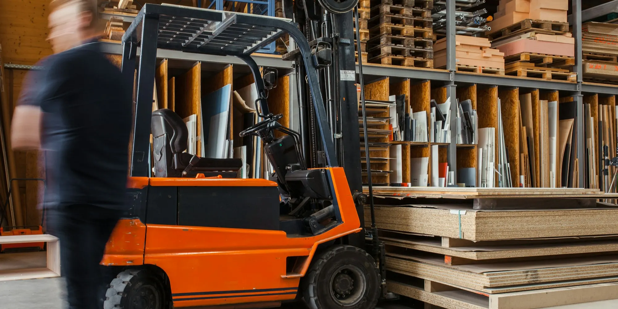 Yellow forklift in a warehouse aisle