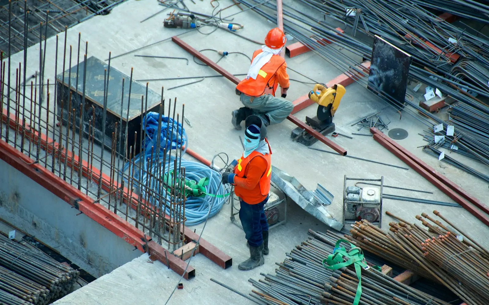 Construction crew working on a building site seen from above