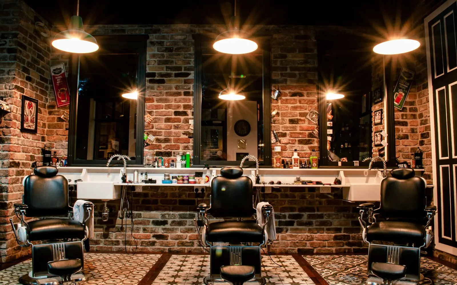 Leather barber chairs in a brick-walled barbershop