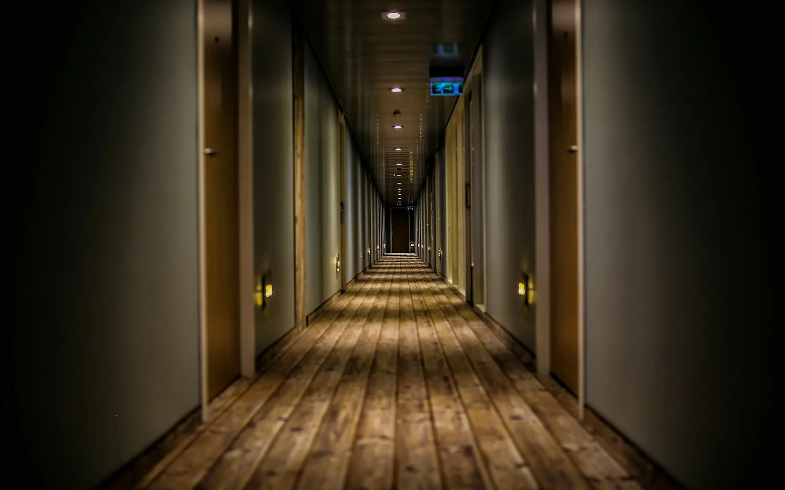 Long hallway of guest rooms in a hotel